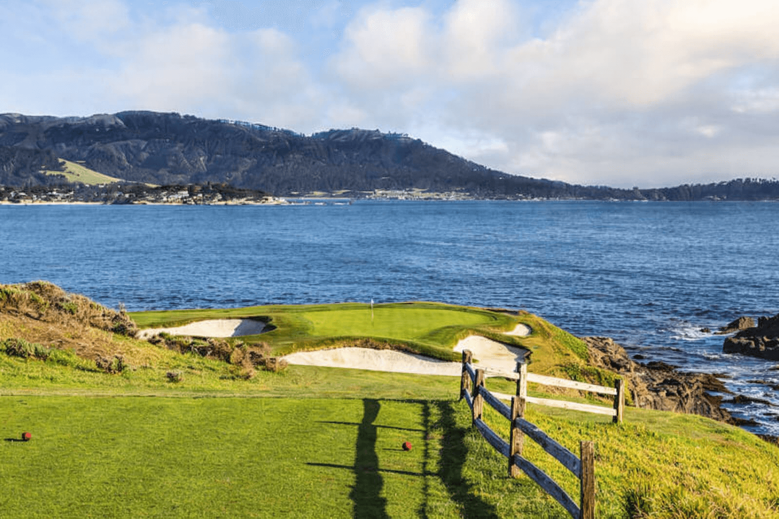 Traditional golf hole near an ocean cliff